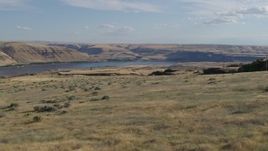 5.7K aerial stock footage fly over cliff toward Miller Island and the Columbia River in Goldendale, Washington Aerial Stock Footage | DX0001_019_020