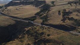 5.7K aerial stock footage of a big rig traveling on Lewis and Clark Highway in Goldendale, Washington Aerial Stock Footage | DX0001_019_031