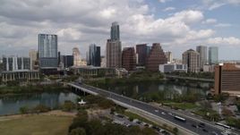 5.7K aerial stock footage of the city's skyline while flying by First Street Bridge and Lady Bird Lake, Downtown Austin, Texas Aerial Stock Footage | DX0002_102_001