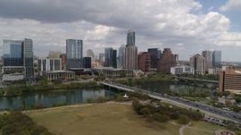 5.7K aerial stock footage of First Street Bridge and Lady Bird Lake with view of skyline, Downtown Austin, Texas Aerial Stock Footage | DX0002_102_005