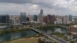 5.7K aerial stock footage of the city skyline seen from across Lady Bird Lake, Downtown Austin, Texas Aerial Stock Footage | DX0002_102_007