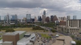 5.7K aerial stock footage approach First Street Bridge, Lady Bird Lake, and the city skyline, Downtown Austin, Texas Aerial Stock Footage | DX0002_102_010