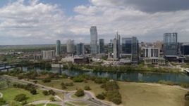 5.7K aerial stock footage of a view of city skyscrapers across Lady Bird Lake, Downtown Austin, Texas Aerial Stock Footage | DX0002_102_012