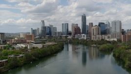 5.7K aerial stock footage of a reverse view of the city skyline from Lady Bird Lake, Downtown Austin, Texas Aerial Stock Footage | DX0002_102_017