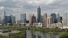 5.7K aerial stock footage ascend over Lady Bird Lake, approach skyscrapers in Downtown Austin, Texas Aerial Stock Footage | DX0002_103_001