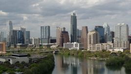 5.7K aerial stock footage a view of skyscrapers in Downtown Austin, Texas while flying over Lady Bird Lake Aerial Stock Footage | DX0002_103_004