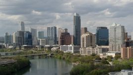 5.7K aerial stock footage a view of skyscrapers in Downtown Austin, Texas while ascending over Lady Bird Lake Aerial Stock Footage | DX0002_103_005