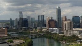 5.7K aerial stock footage reverse view of waterfront skyscrapers by Lady Bird Lake in Downtown Austin, Texas Aerial Stock Footage | DX0002_103_008