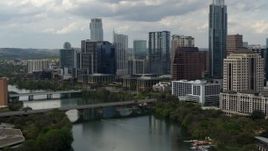 5.7K aerial stock footage follow Lady Bird Lake toward skyscrapers in Downtown Austin, Texas Aerial Stock Footage | DX0002_103_012