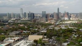 5.7K aerial stock footage approach and ascend near Congress Avenue leading to city's skyline in Downtown Austin, Texas Aerial Stock Footage | DX0002_103_026