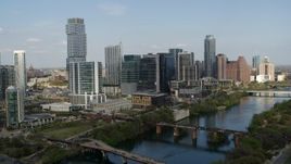 5.7K aerial stock footage flying by skyscrapers and bridges spanning Lady Bird Lake, Downtown Austin, Texas Aerial Stock Footage | DX0002_104_001