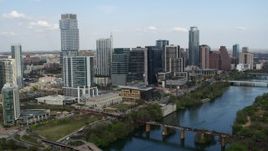 5.7K aerial stock footage ascend and flyby towering skyscrapers and bridges over Lady Bird Lake, Downtown Austin, Texas Aerial Stock Footage | DX0002_104_011