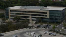 5.7K aerial stock footage of reverse view of a modern office building in Austin, Texas Aerial Stock Footage | DX0002_104_027