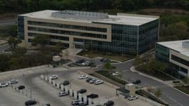 5.7K aerial stock footage of slowly circling around a modern office building in Austin, Texas Aerial Stock Footage | DX0002_104_031