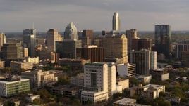 5.7K aerial stock footage passing courthouse near office buildings and skyscrapers at sunset in Downtown Austin, Texas Aerial Stock Footage | DX0002_104_045