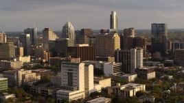 5.7K aerial stock footage flyby courthouse and office buildings near skyscrapers at sunset in Downtown Austin, Texas Aerial Stock Footage | DX0002_104_046