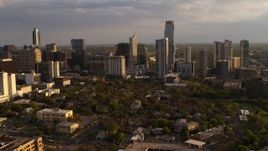 5.7K aerial stock footage of flying by tall city skyscrapers at sunset in Downtown Austin, Texas Aerial Stock Footage | DX0002_105_002