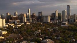5.7K aerial stock footage ascend while focused on office buildings and skyscrapers at sunset in Downtown Austin, Texas Aerial Stock Footage | DX0002_105_011