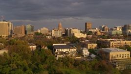 5.7K aerial stock footage Texas State Capitol dome and office buildings at sunset in Downtown Austin, Texas Aerial Stock Footage | DX0002_105_013