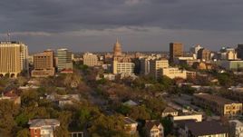 5.7K aerial stock footage Texas State Capitol dome at the center of office buildings at sunset in Downtown Austin, Texas Aerial Stock Footage | DX0002_105_015