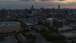 5.7K aerial stock footage approach hospital with skyscrapers in the background at sunset in Downtown Austin, Texas Aerial Stock Footage | DX0002_105_017