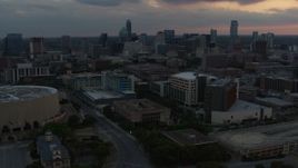 5.7K aerial stock footage reverse view of hospital, skyscrapers and capitol dome at sunset in Downtown Austin, Texas Aerial Stock Footage | DX0002_105_018