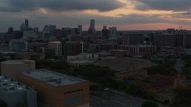 5.7K aerial stock footage office buildings and capitol dome at sunset, skyscrapers in background in Downtown Austin, Texas Aerial Stock Footage | DX0002_105_020