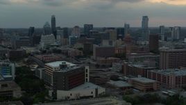 5.7K aerial stock footage office buildings around capitol dome at sunset, skyscrapers in background in Downtown Austin, Texas Aerial Stock Footage | DX0002_105_022
