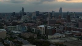 5.7K aerial stock footage approach hospital, skyscrapers and capitol dome in distance at sunset in Downtown Austin, Texas Aerial Stock Footage | DX0002_105_024
