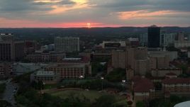 5.7K aerial stock footage of the setting sun while descending near the university, Austin, Texas Aerial Stock Footage | DX0002_105_025