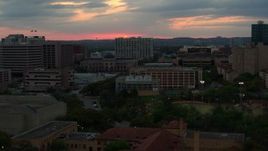 5.7K aerial stock footage of the setting sun while passing near the university, Austin, Texas Aerial Stock Footage | DX0002_105_027