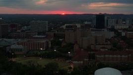 5.7K aerial stock footage flyby the university campus with setting sun in distance, Austin, Texas Aerial Stock Footage | DX0002_105_033