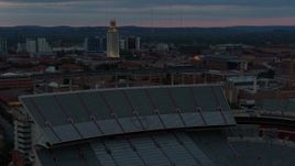 5.7K aerial stock footage of UT Tower and football stadium at the University of Texas at twilight, Austin, Texas Aerial Stock Footage | DX0002_105_036