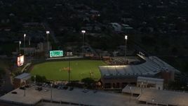 5.7K aerial stock footage of a baseball game at a stadium at the University of Texas at twilight, Austin, Texas Aerial Stock Footage | DX0002_105_038