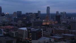 5.7K aerial stock footage office buildings around capitol at twilight, skyscrapers in background in Downtown Austin, Texas Aerial Stock Footage | DX0002_105_040