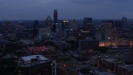 5.7K aerial stock footage flyby office buildings and skyscrapers at twilight, reveal capitol in Downtown Austin, Texas Aerial Stock Footage | DX0002_105_043