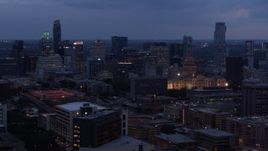 5.7K aerial stock footage of passing by office buildings, capitol and skyscrapers at twilight in Downtown Austin, Texas Aerial Stock Footage | DX0002_105_045