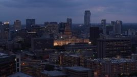 5.7K aerial stock footage of a view of office buildings, capitol and skyscrapers at twilight in Downtown Austin, Texas Aerial Stock Footage | DX0002_105_048