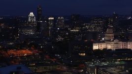 5.7K aerial stock footage flyby office buildings and skyscrapers at night, reveal capitol in Downtown Austin, Texas Aerial Stock Footage | DX0002_106_002