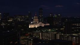 5.7K aerial stock footage of passing the Texas State Capitol at night in Downtown Austin, Texas Aerial Stock Footage | DX0002_106_008