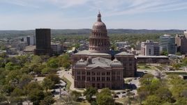 5.7K aerial stock footage ascend over library for view of Texas State Capitol in Downtown Austin, Texas Aerial Stock Footage | DX0002_107_013