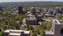 5.7K aerial stock footage of a wide orbit around the Texas State Capitol dome and grounds in Downtown Austin, Texas Aerial Stock Footage | DX0002_107_015