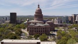 5.7K aerial stock footage fly over library and approach the Texas State Capitol building in Downtown Austin, Texas Aerial Stock Footage | DX0002_107_020