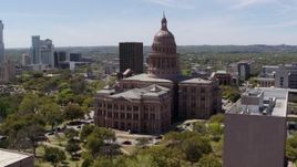5.7K aerial stock footage flyby government office building, approach Texas State Capitol in Downtown Austin, Texas Aerial Stock Footage | DX0002_107_024