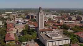 5.7K aerial stock footage of a reverse view of UT Tower at the University of Texas, Austin, Texas Aerial Stock Footage | DX0002_107_035