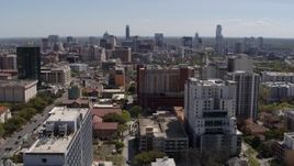 5.7K aerial stock footage ascend from the University of Texas for view of skyline of Downtown Austin, Texas Aerial Stock Footage | DX0002_107_041
