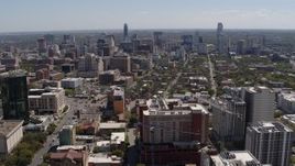 5.7K aerial stock footage reverse view of the city's skyline, seen from the University of Texas, Downtown Austin, Texas Aerial Stock Footage | DX0002_107_042