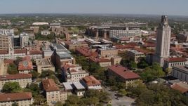5.7K aerial stock footage of descending by campus buildings and UT Tower at the University of Texas, Austin, Texas Aerial Stock Footage | DX0002_107_044