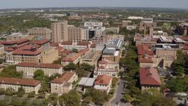 5.7K aerial stock footage of slowly flying by campus buildings at the University of Texas, Austin, Texas Aerial Stock Footage | DX0002_107_045