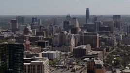 5.7K aerial stock footage descend and fly away from capitol, office buildings and city skyline in Downtown Austin, Texas Aerial Stock Footage | DX0002_108_006
